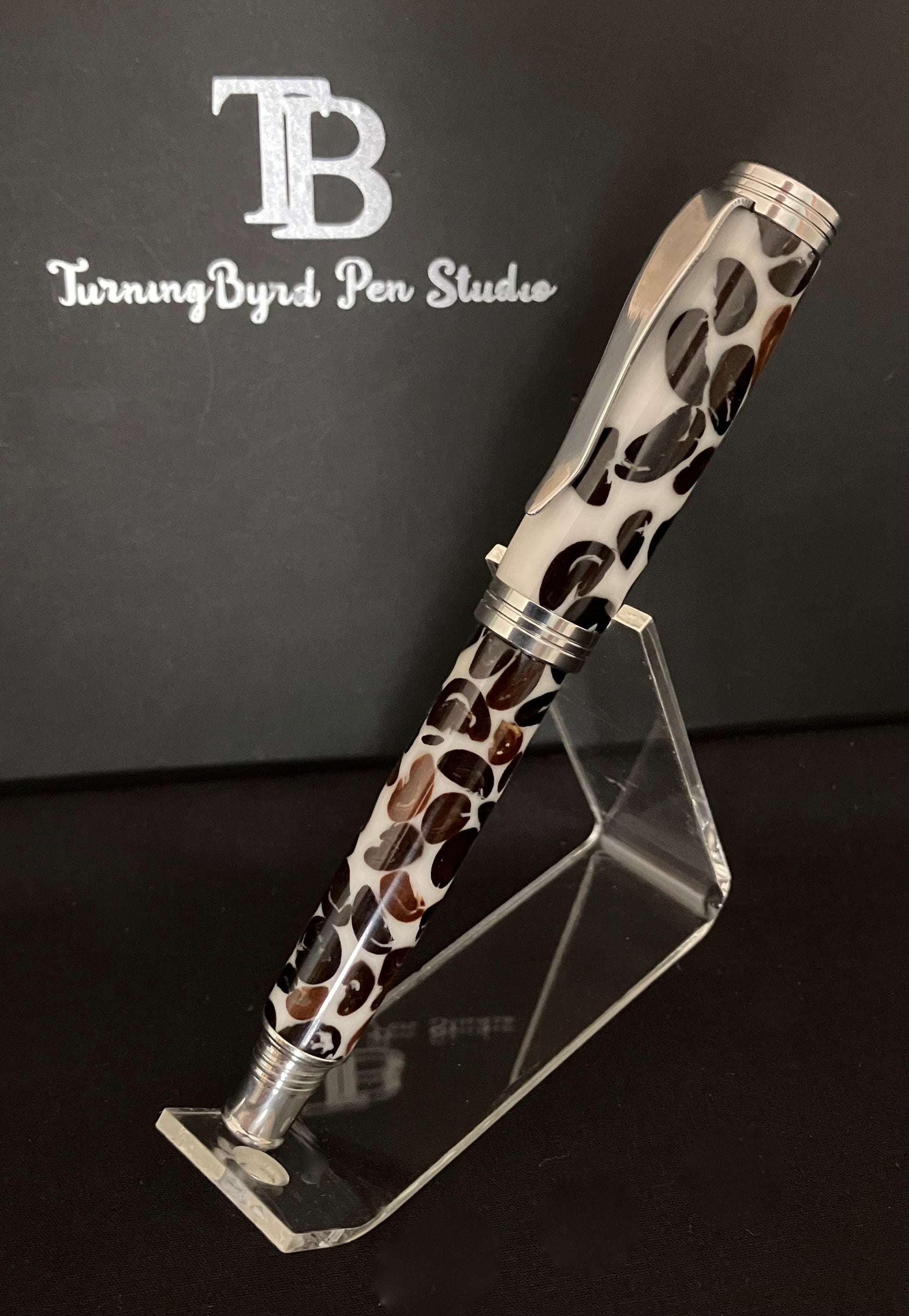 A rollerball pen with coffee beans cast in white Resin