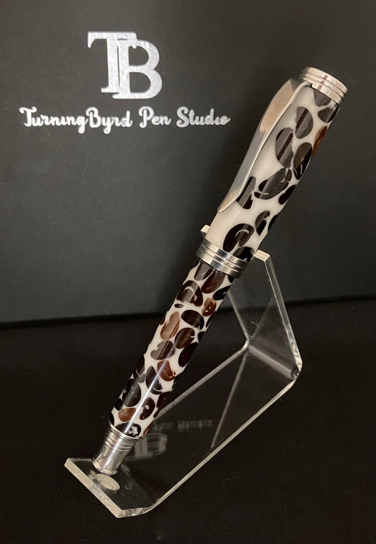 A rollerball pen with coffee beans cast in white Resin