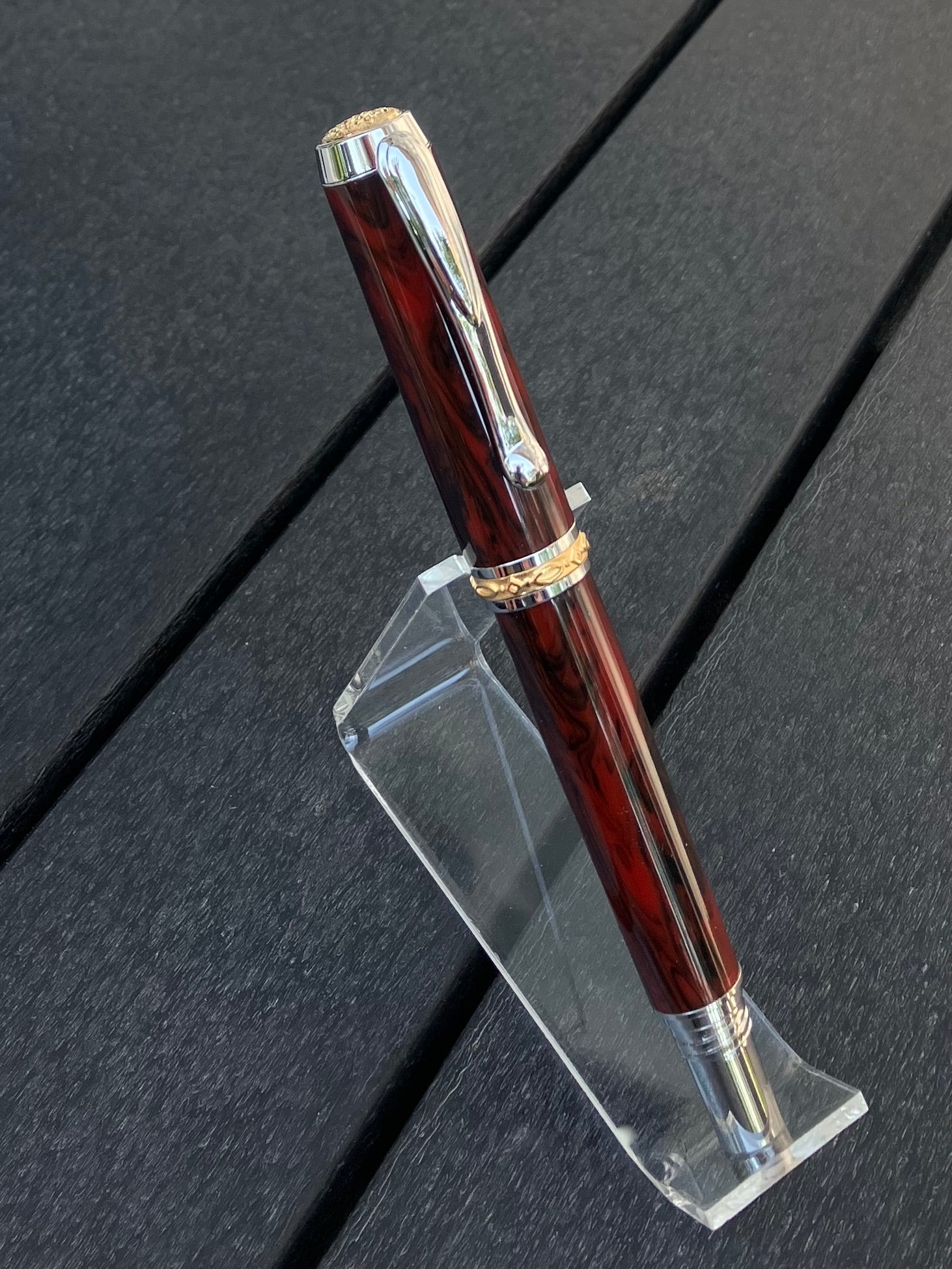 Mahogany Obsidian - Handcrafted Rollerball Pen.  This stunning pen is made with TruStone, a combination of real stone powder and acrylic resin, and features Rhodium with Gold accents for a luxurious look.