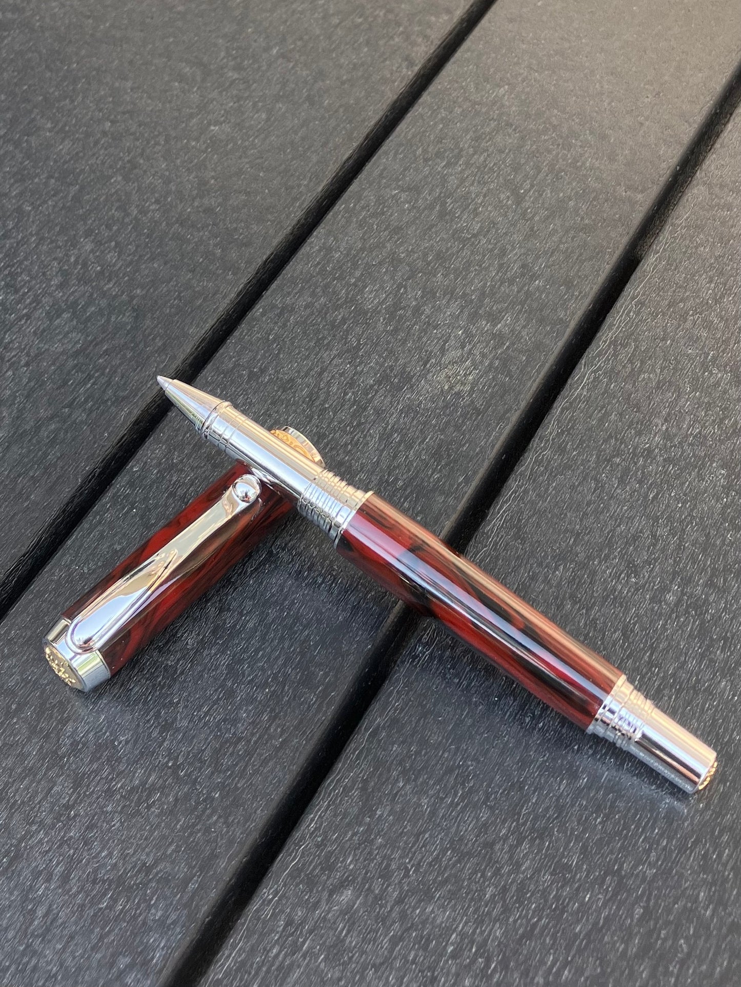 Mahogany Obsidian - Handcrafted Rollerball Pen.  This stunning pen is made with TruStone, a combination of real stone powder and acrylic resin, and features Rhodium with Gold accents for a luxurious look.