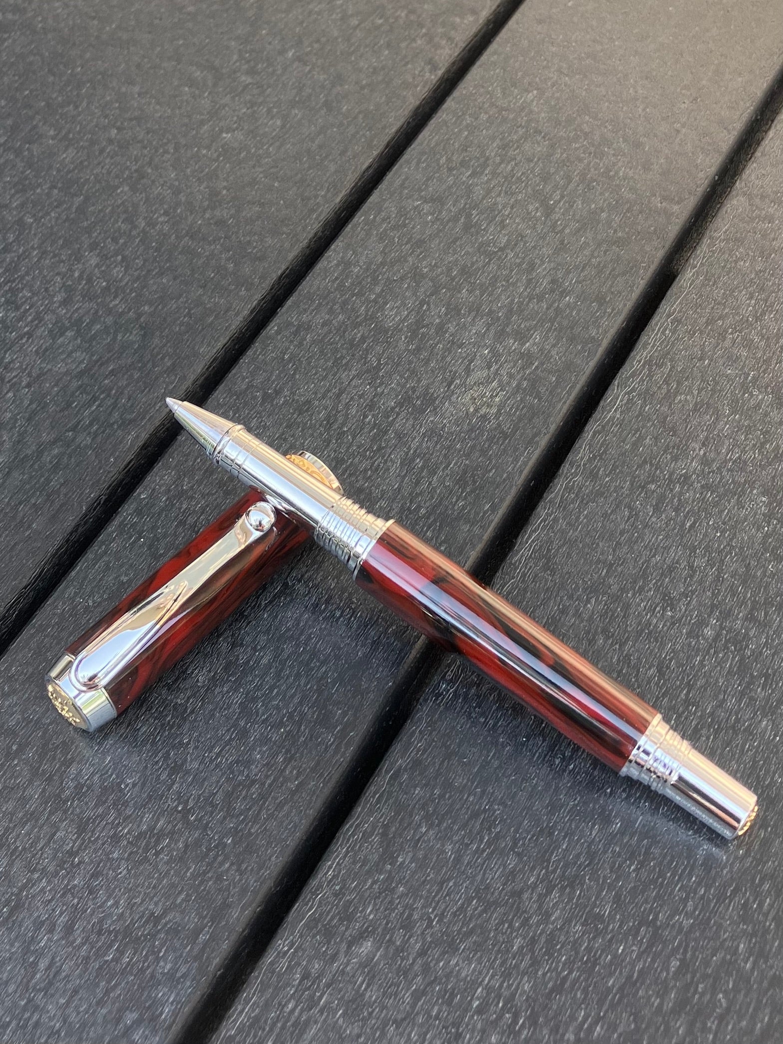 Mahogany Obsidian - Handcrafted Rollerball Pen.  This stunning pen is made with TruStone, a combination of real stone powder and acrylic resin, and features Rhodium with Gold accents for a luxurious look.