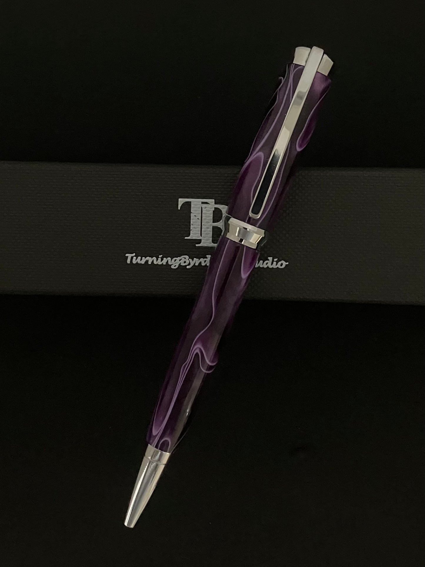 Purple with white ribbons on a chrome body