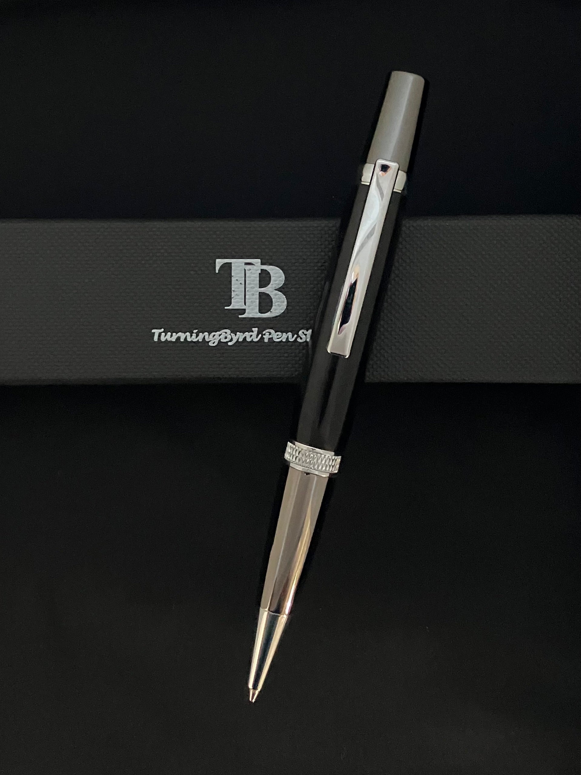 Barrel is deep black burgundy resin, twist operation and chrome plated