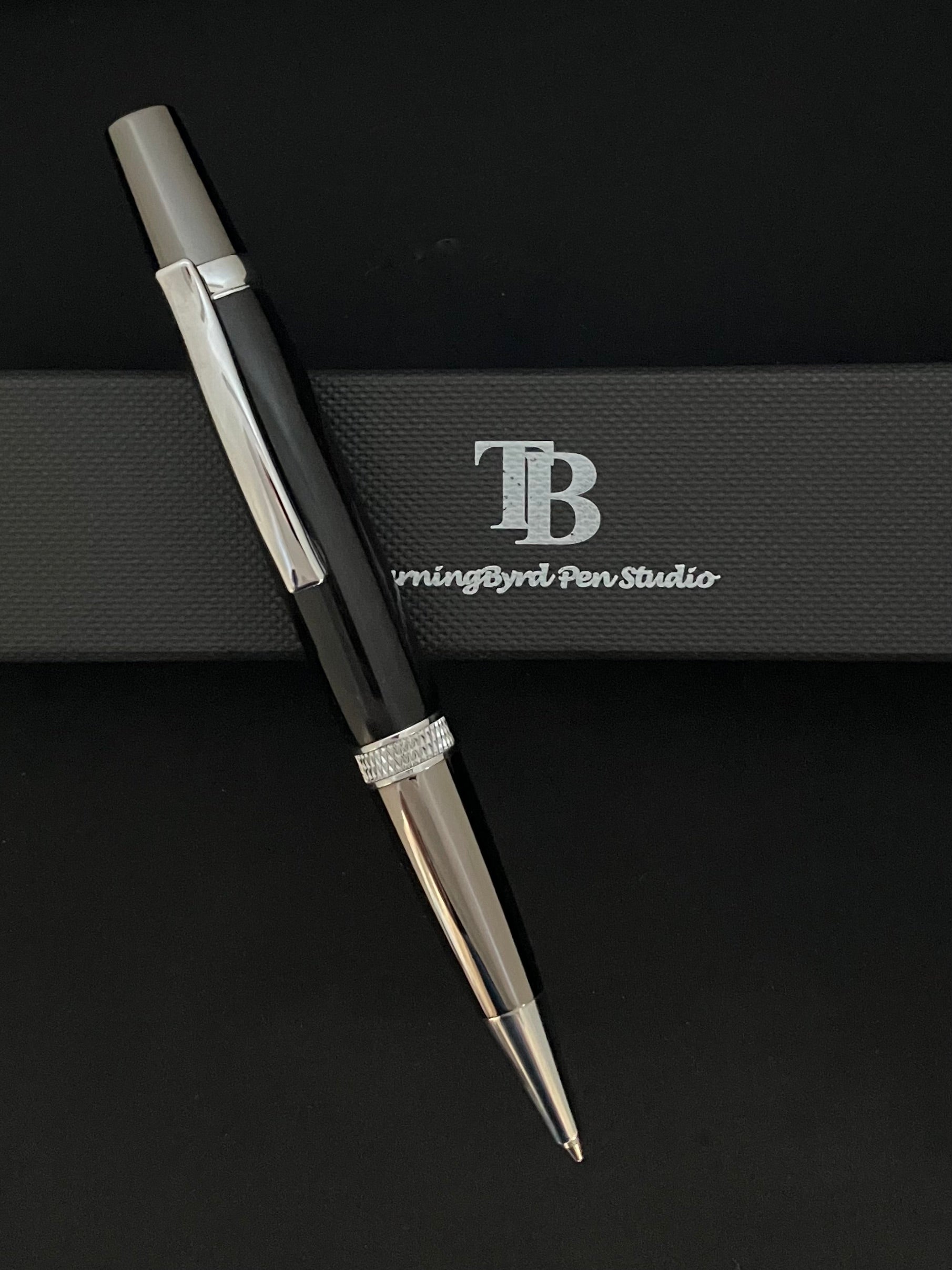 Barrel is deep black burgundy resin, twist operation and chrome plated