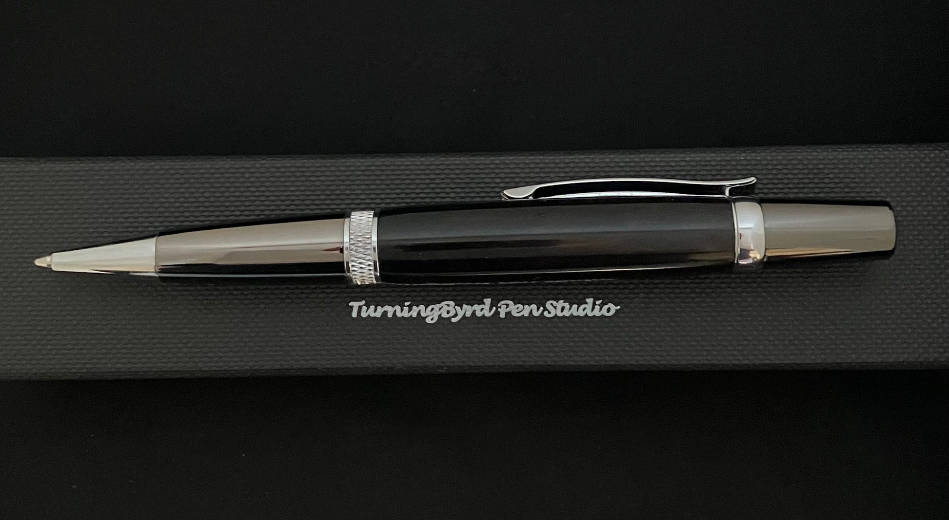 Barrel is deep black burgundy resin, twist operation and chrome plated