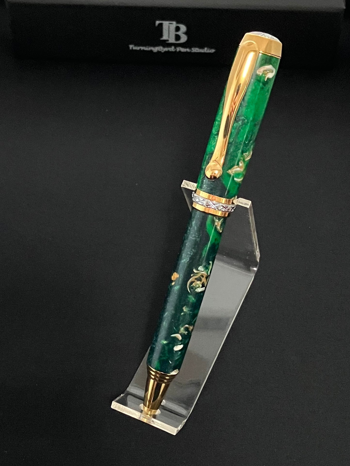 Gold plated twist ballpoint pen with sparkling green resins with bits of sea shells included!