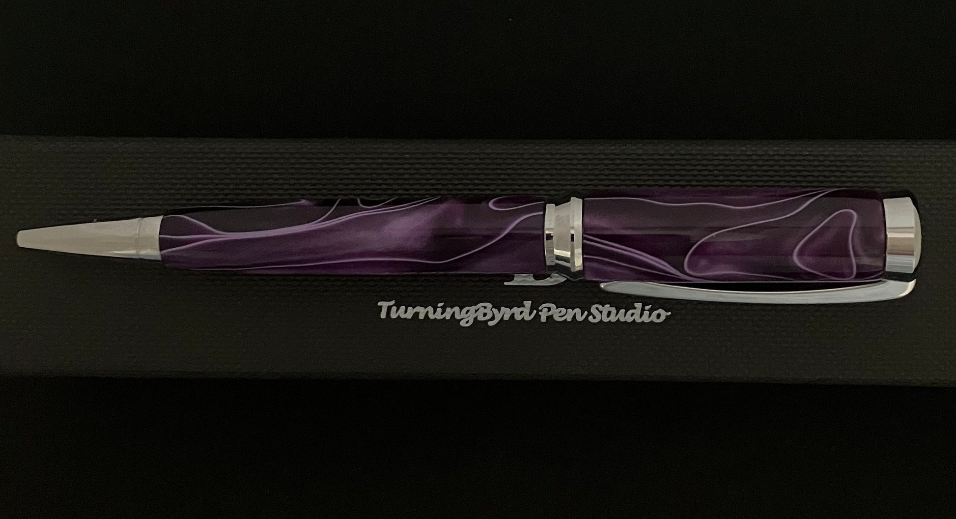 Purple with white ribbons on a chrome body