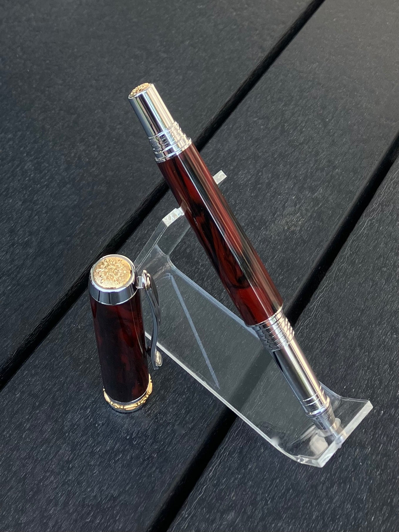 Mahogany Obsidian - Handcrafted Rollerball Pen.  This stunning pen is made with TruStone, a combination of real stone powder and acrylic resin, and features Rhodium with Gold accents for a luxurious look.