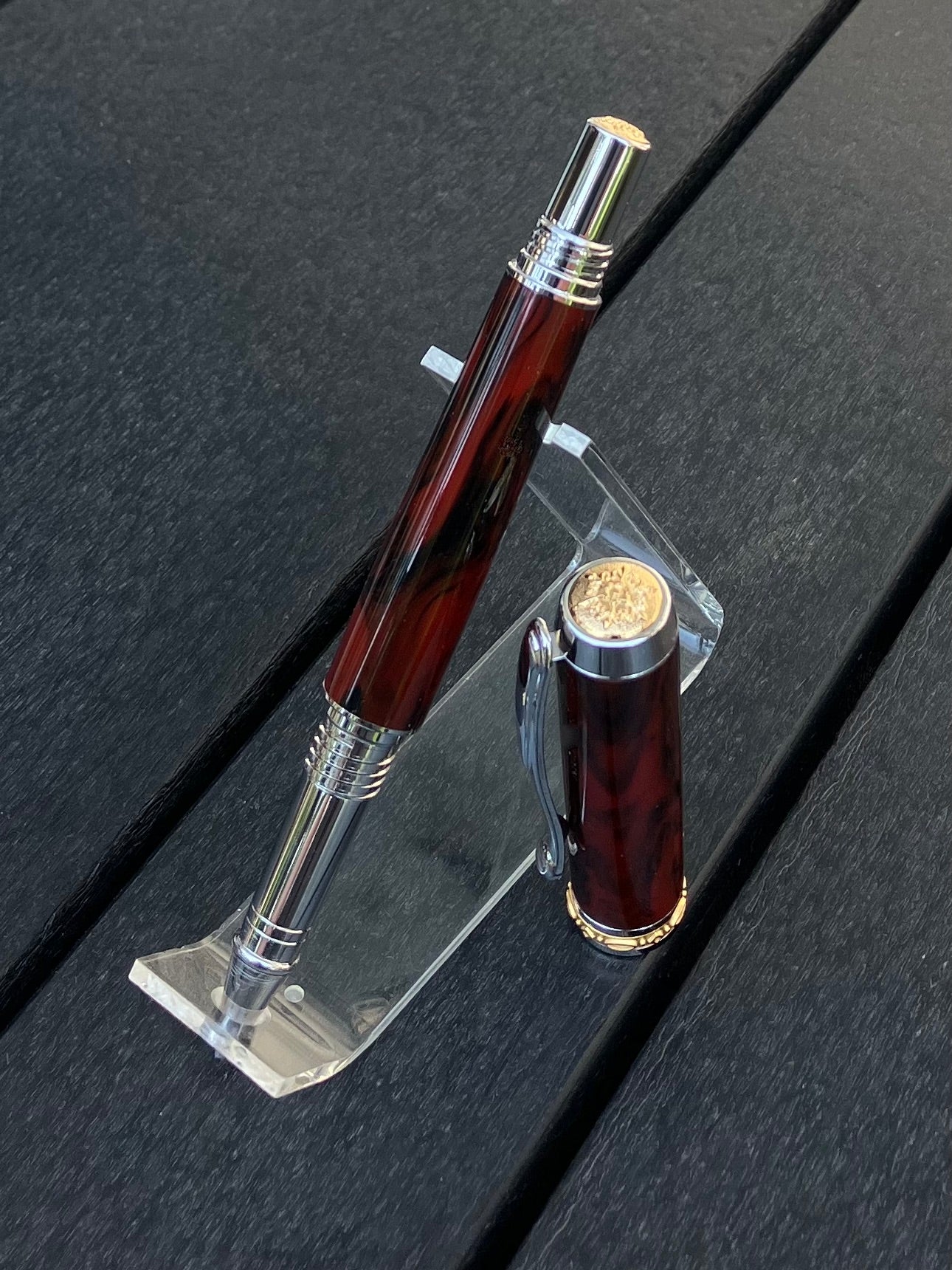 Mahogany Obsidian - Handcrafted Rollerball Pen.  This stunning pen is made with TruStone, a combination of real stone powder and acrylic resin, and features Rhodium with Gold accents for a luxurious look.